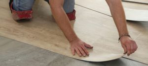 Man-installing-vinyl-floor